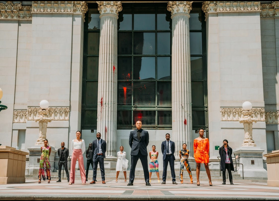 Models in front of building