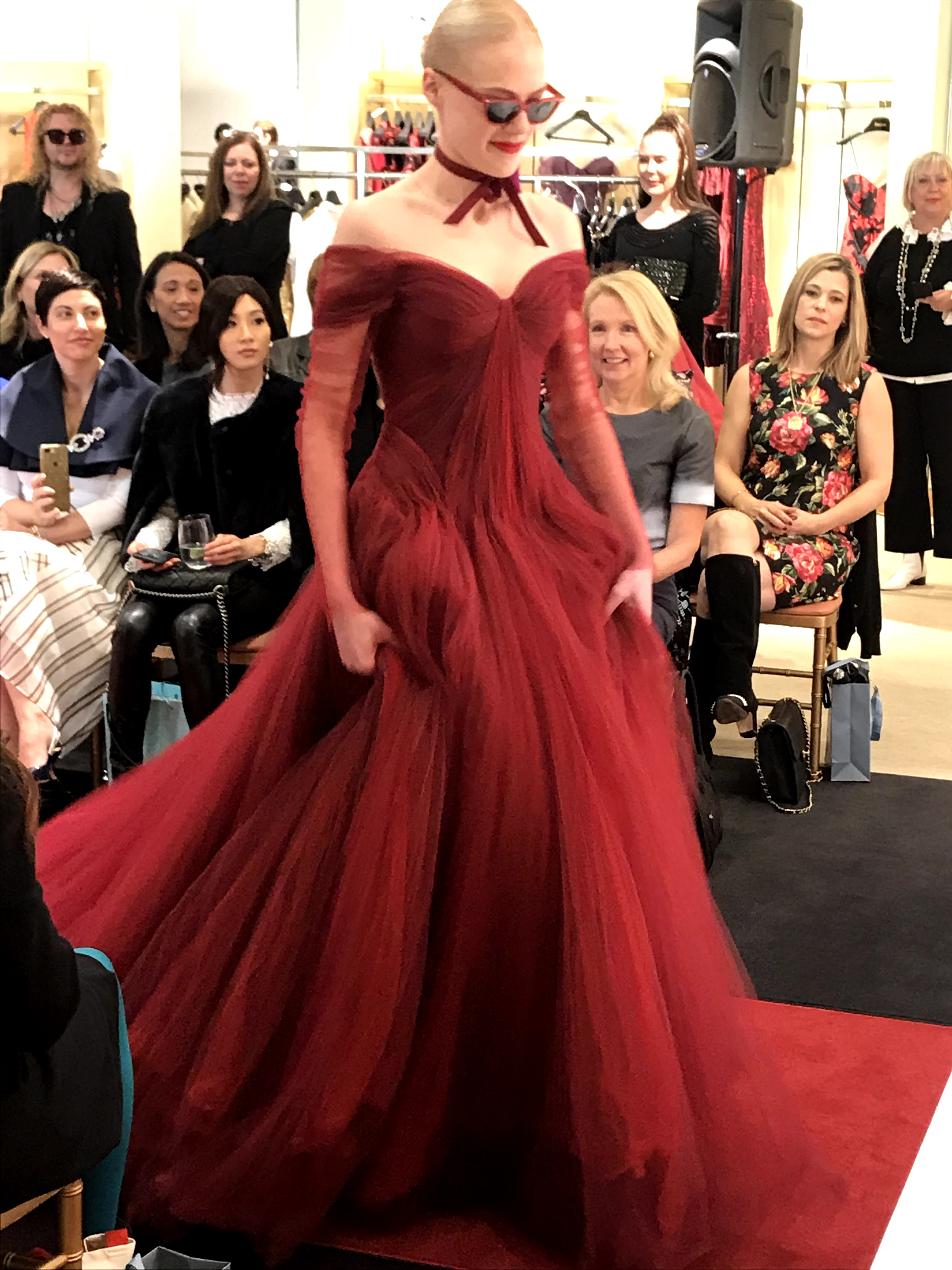Model in red dress at fashion show