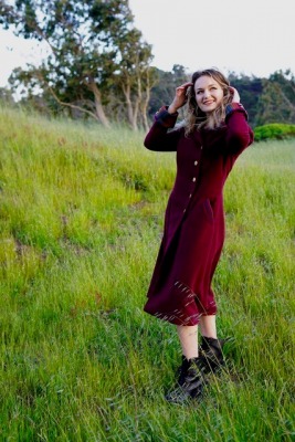 Photo of model in red dress.