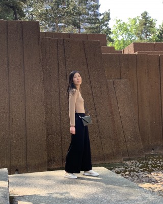 Photo of model in brown dress.