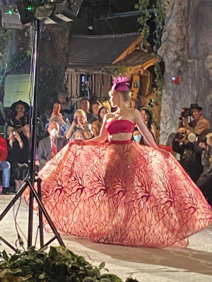 Model in expansive red dress