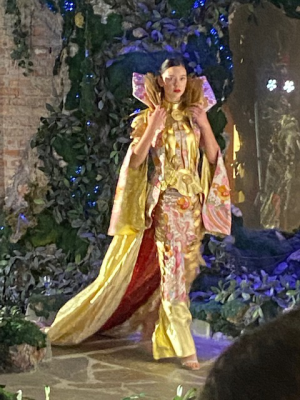 Model in gold dress