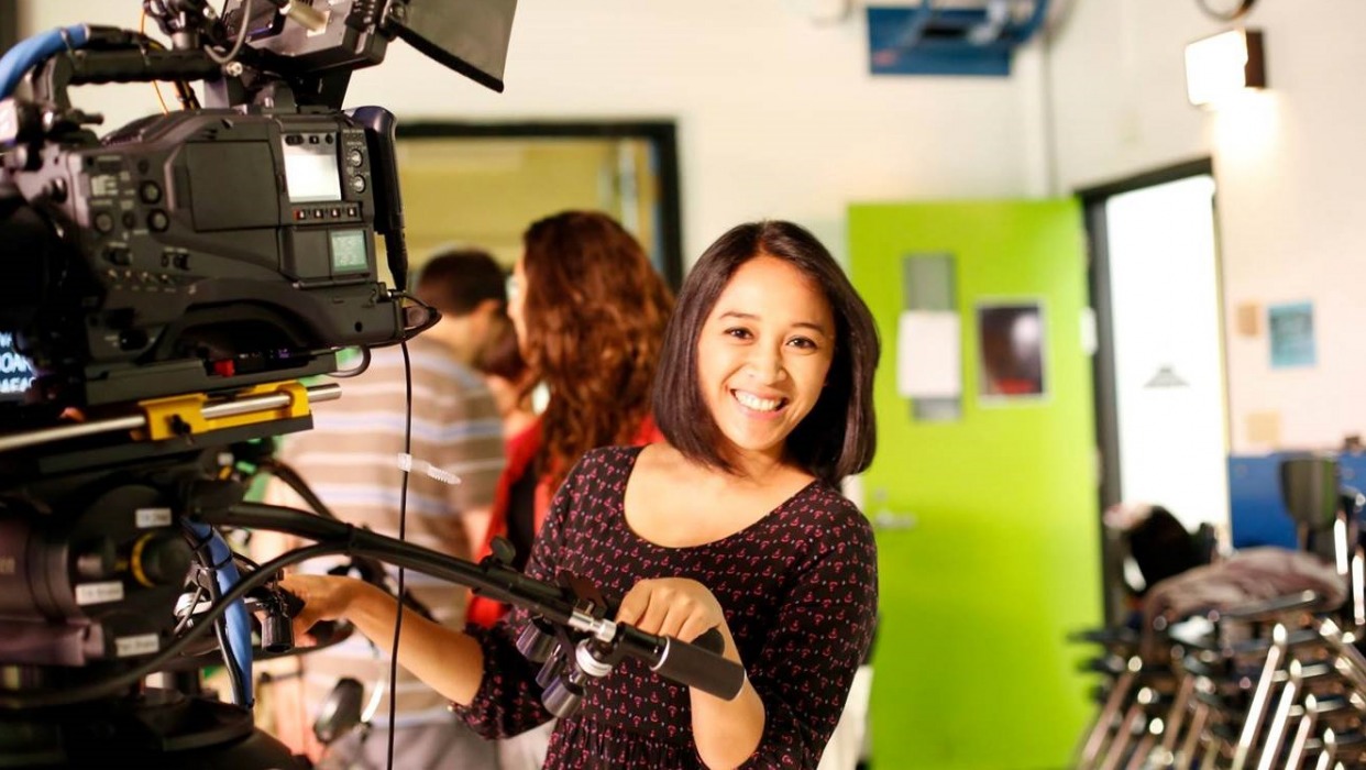 Student operates camera