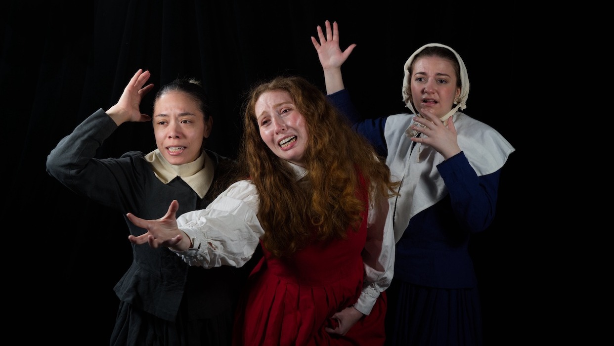 Three actors in stage performance