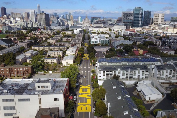 A stretch of roadway leading to San Francisco City Hall has been painted over with a mural that spells out “BLACK LIVES MATTER.”