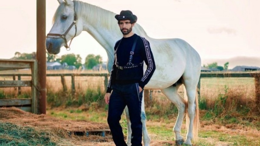 Photo of model with white horse