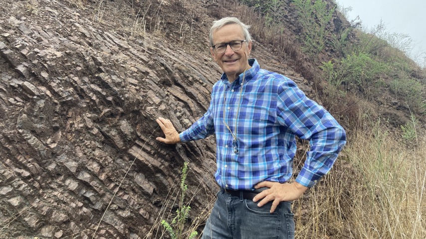 John Sedlander standing in front of ribbon chert in Glen Canyon