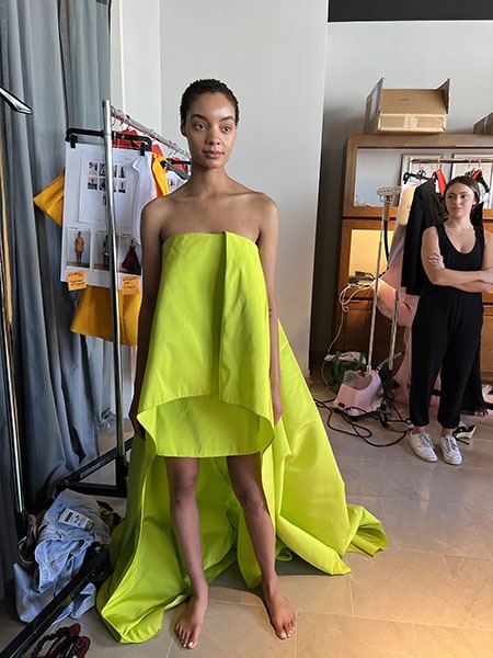 Model in a lime green dress