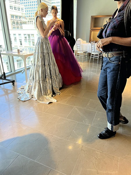 Model in silver dress and model in magenta dress